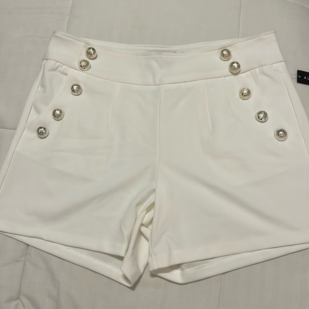 White and gold buttoned shorts